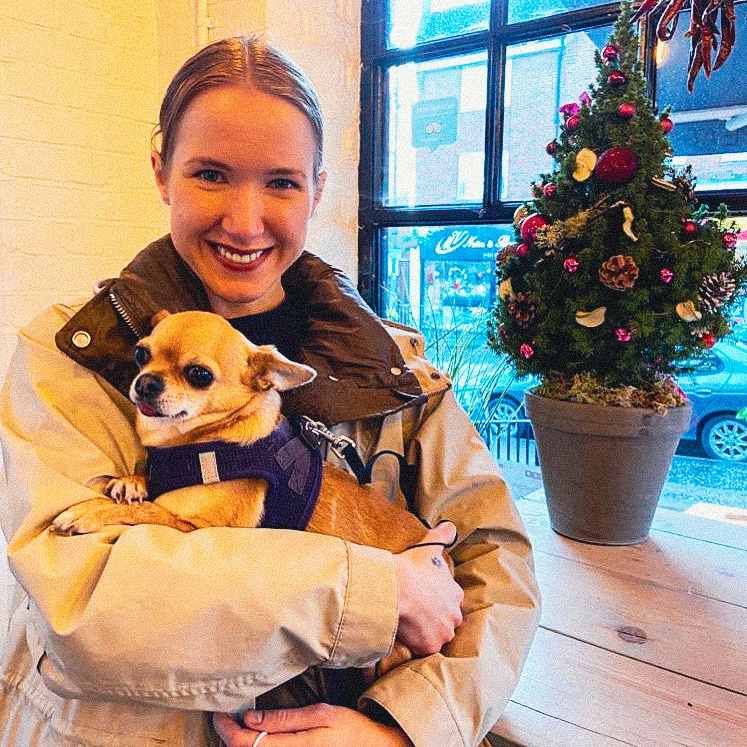 Elena holding a small dog